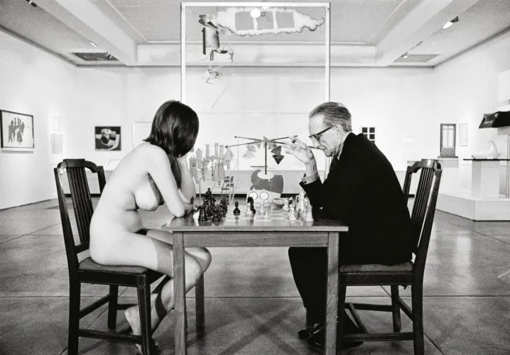 Marcel Duchamp playing chess with Eve Babitz 1963 by Julian Wasser Thumbnail